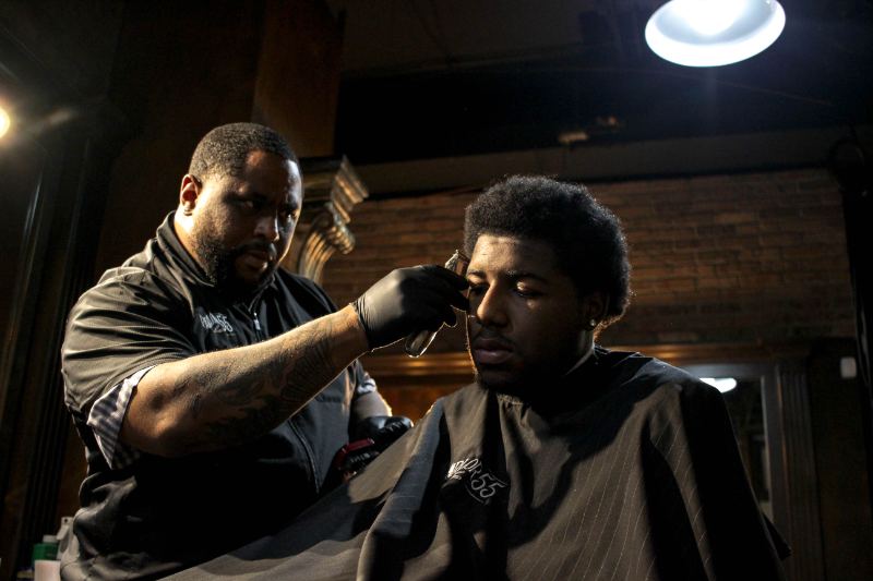 Barber giving a client a fresh cut